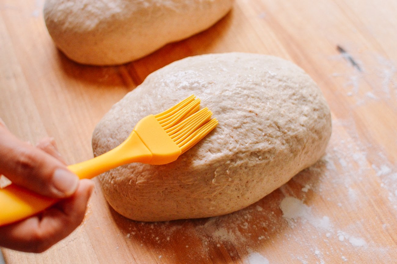 brushing loaf with water
