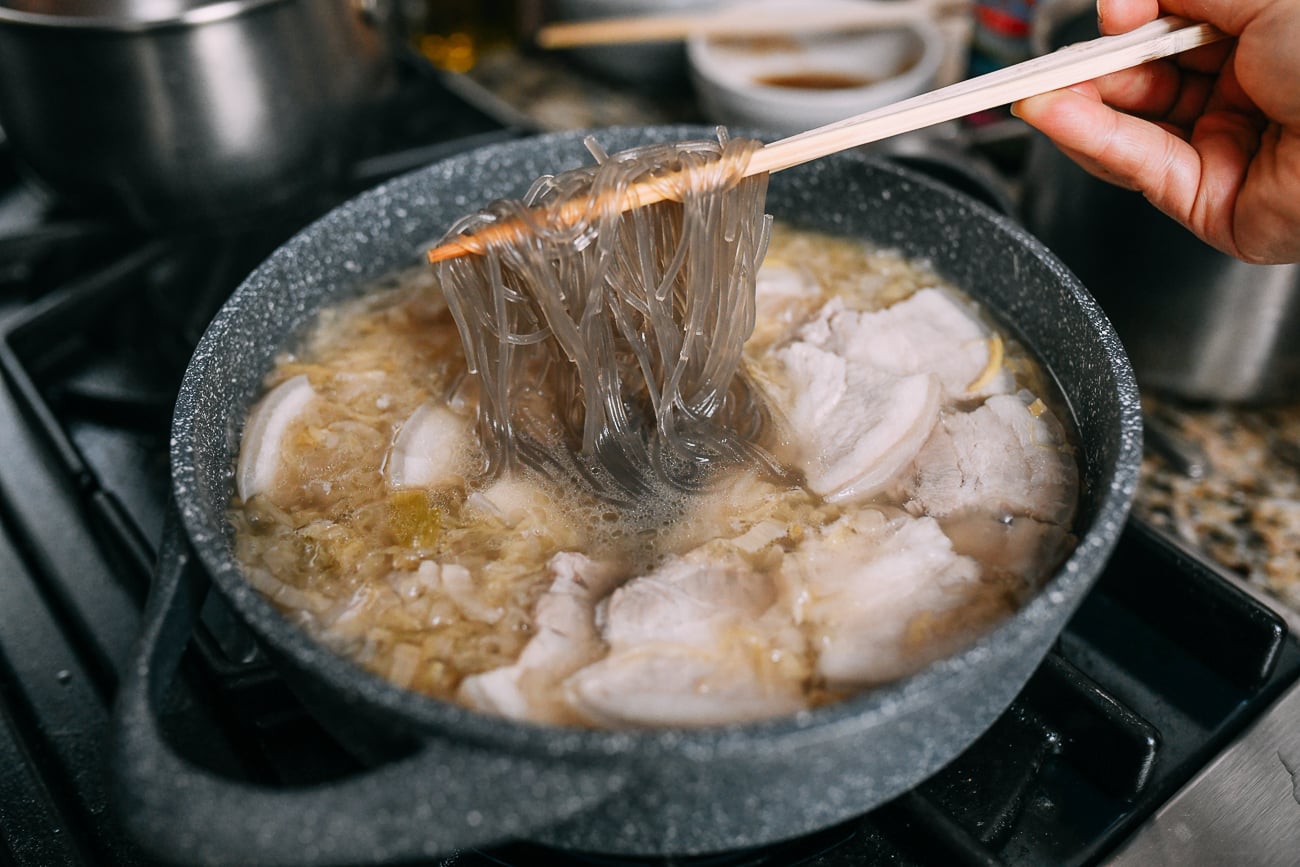 Adding sweet potato starch noodles to sour cabbage soup