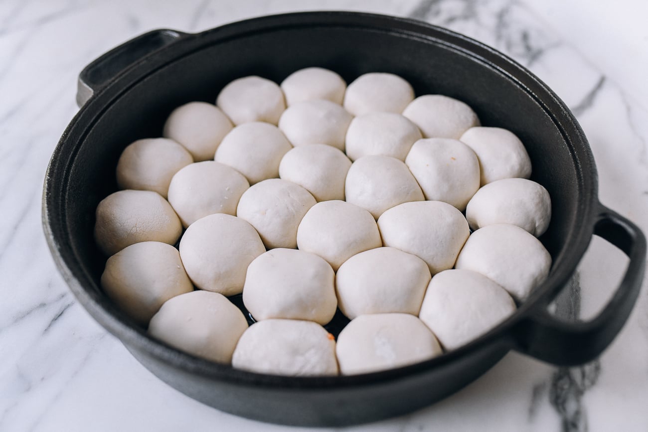 Buns arranged in pan, thewoksoflife.com