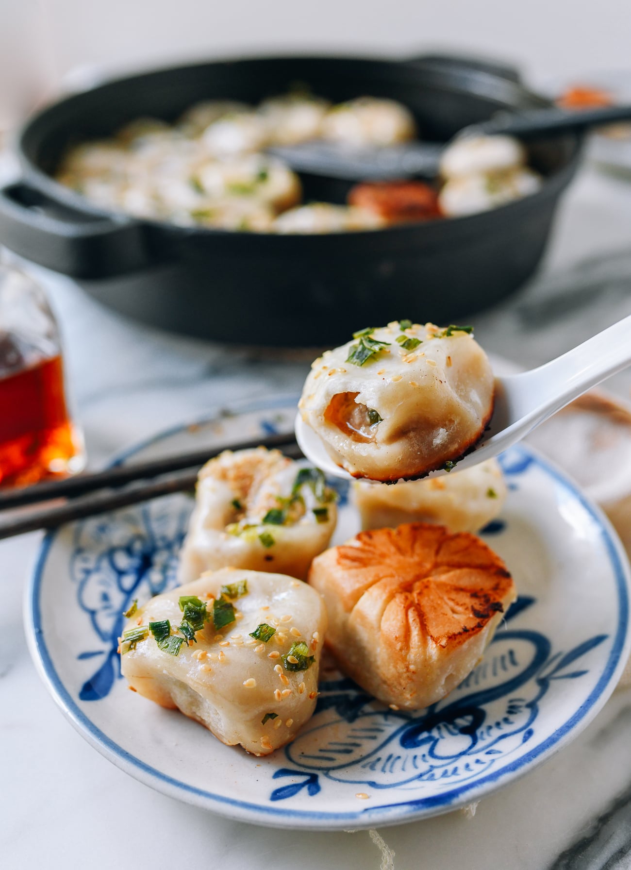 Shanghai Pan-fried Pork Bun (Shengjian Mantou) with soup inside, thewoksoflife.com