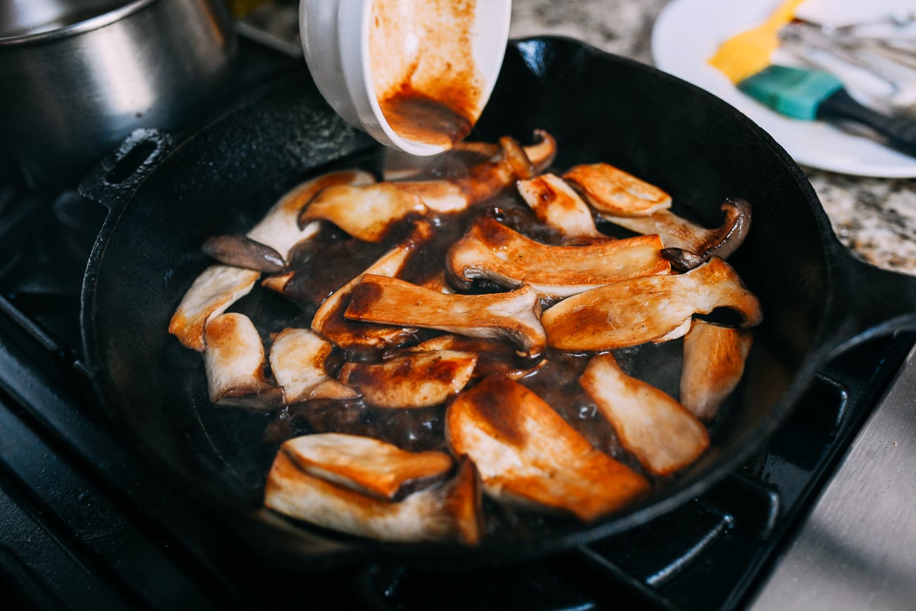 Pouring sauce over mushrooms
