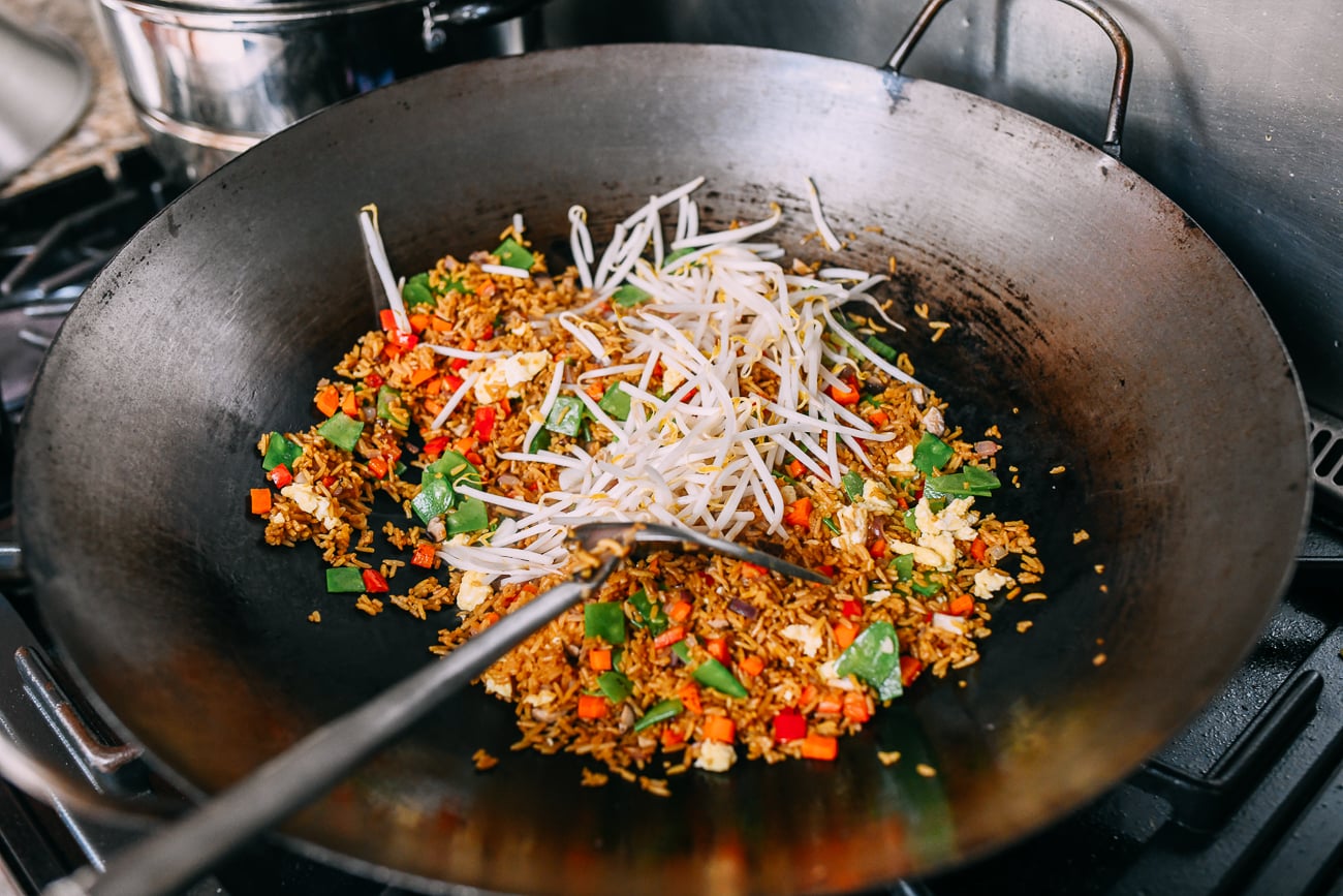 Adding bean sprouts to fried rice
