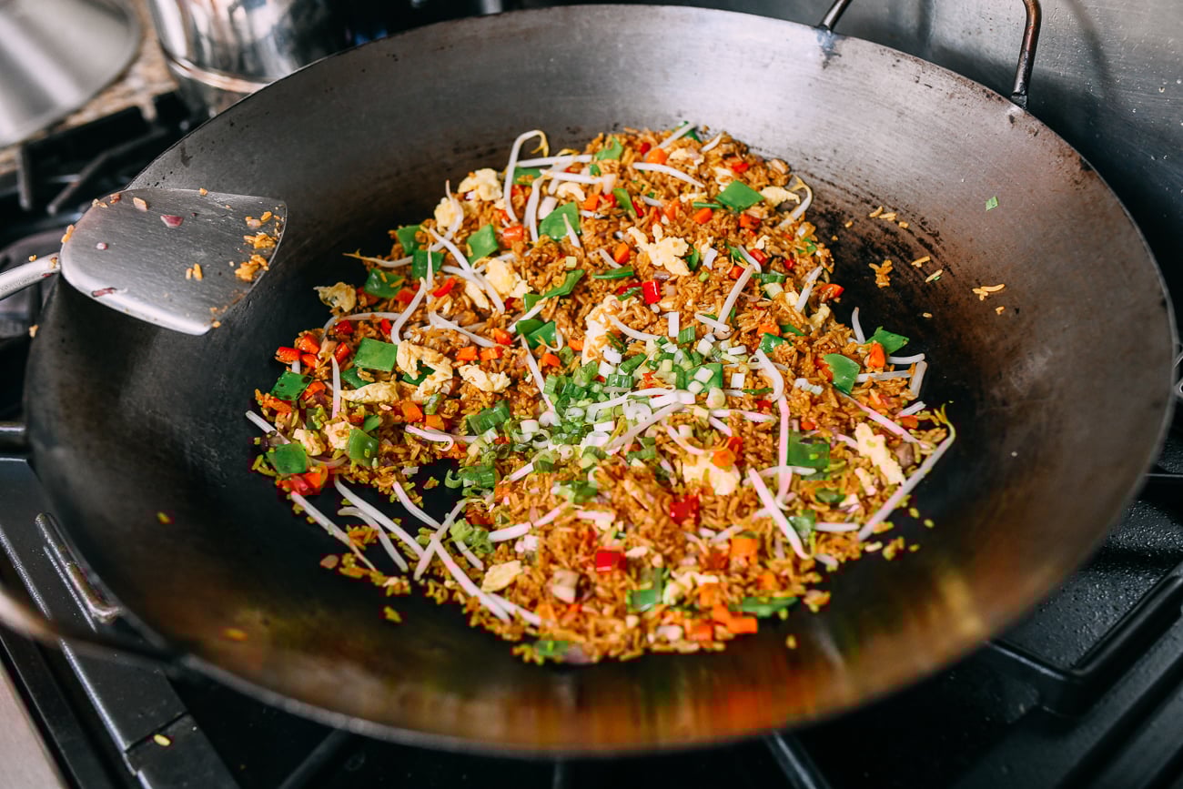 Adding scallions to fried rice