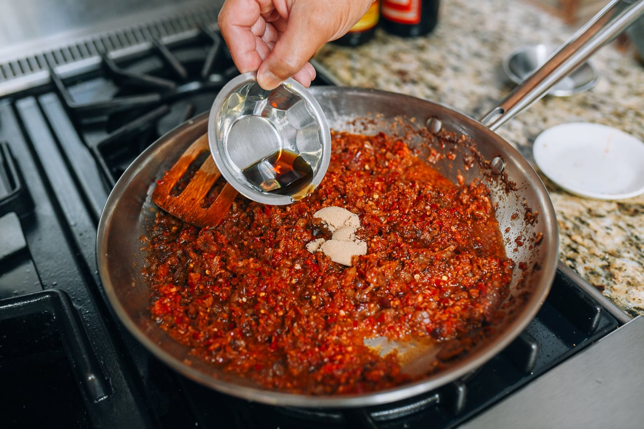 Adding fish sauce and brown sugar to belacan sauce