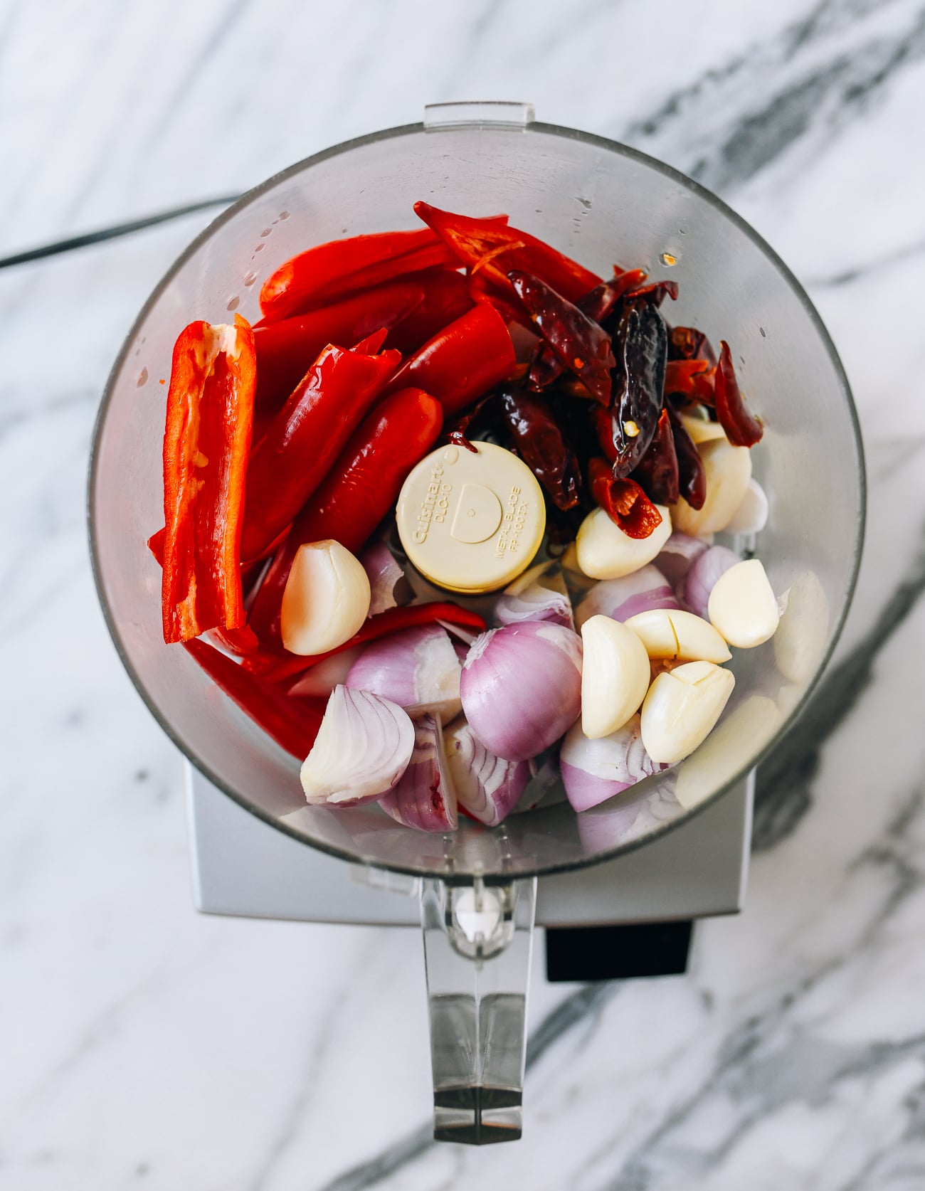 Chilies, garlic, and shallots in food processor