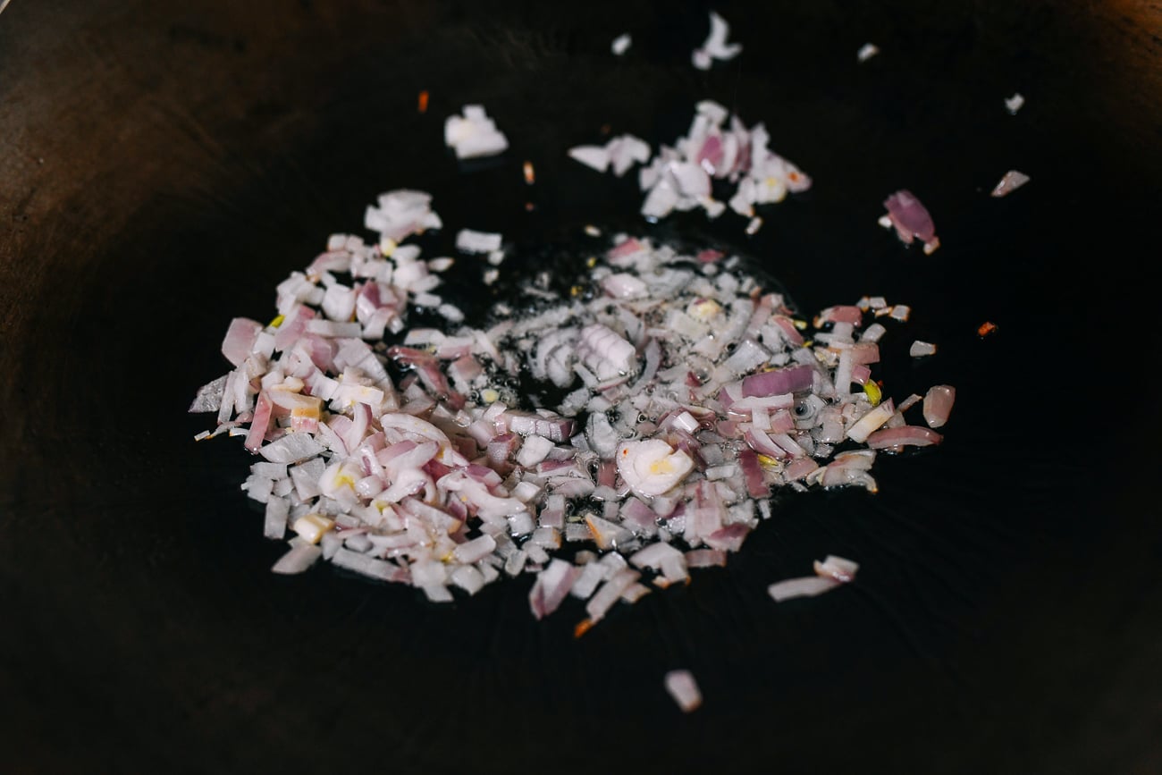 Cooking shallots in wok