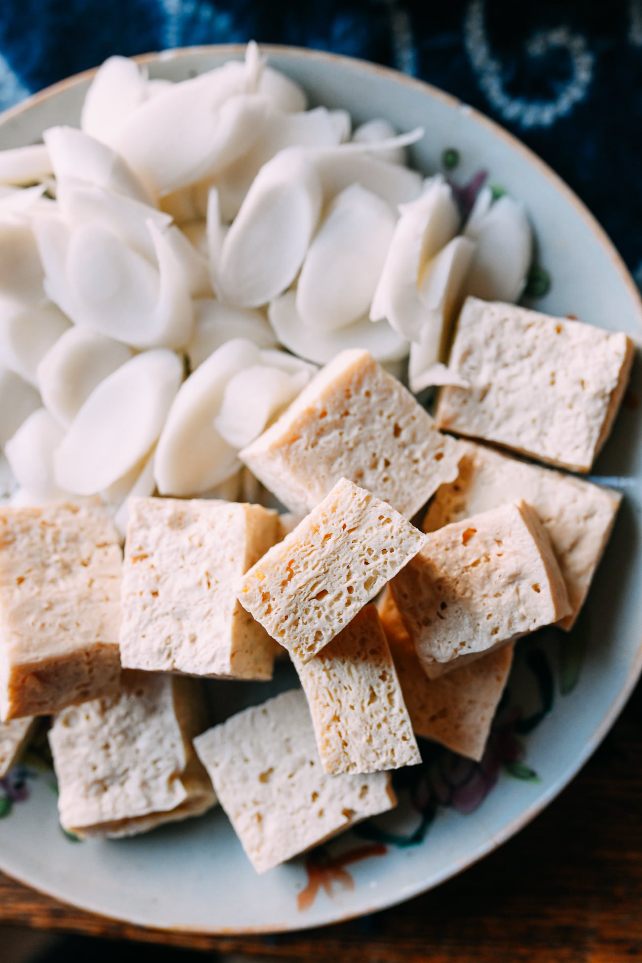 Frozen tofu with rice cakes on plate for hot pot