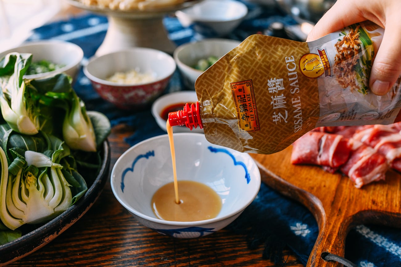 Pouring LKK sesame sauce into small bowl