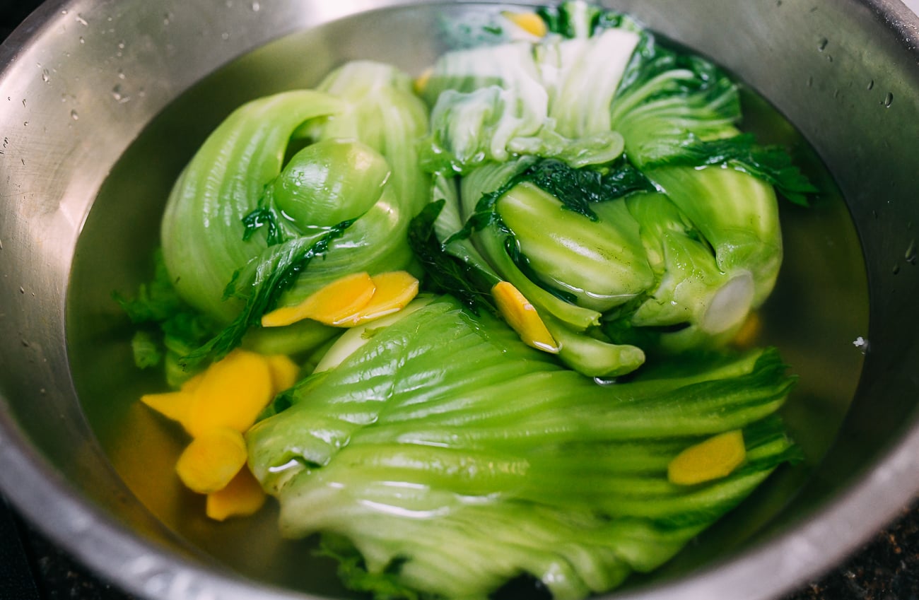 Mustard greens in ginger infused blanching liquid 