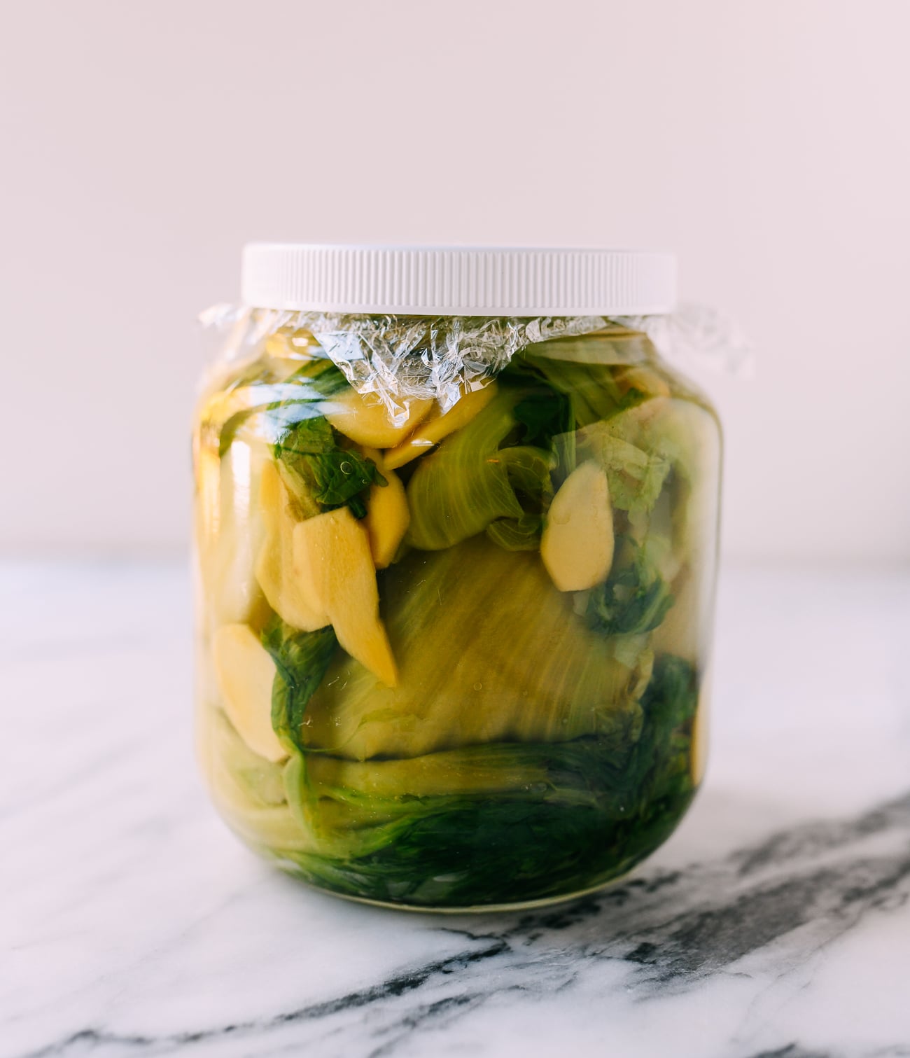 Sealed jar of mustard greens for pickling