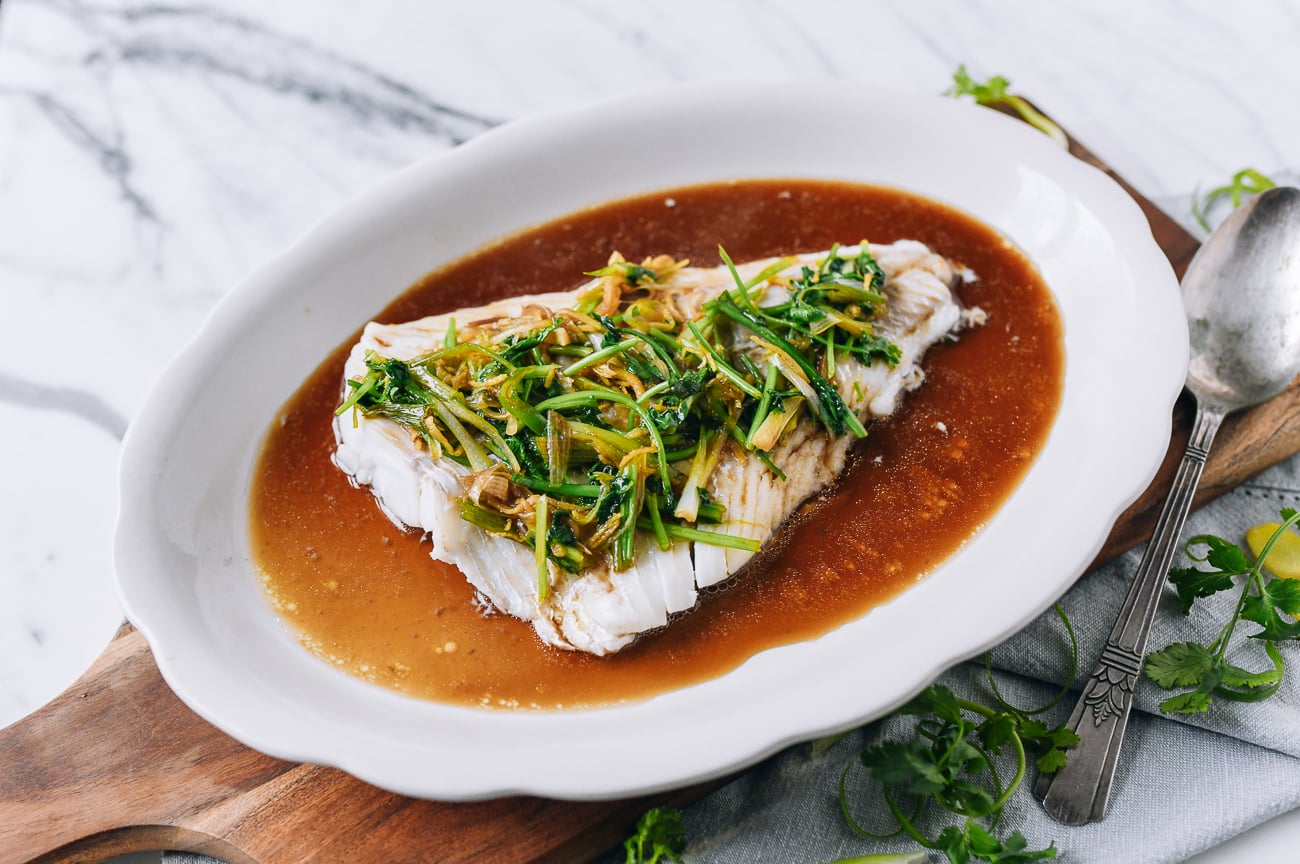 Fish fillet with scallion ginger soy sauce over the top