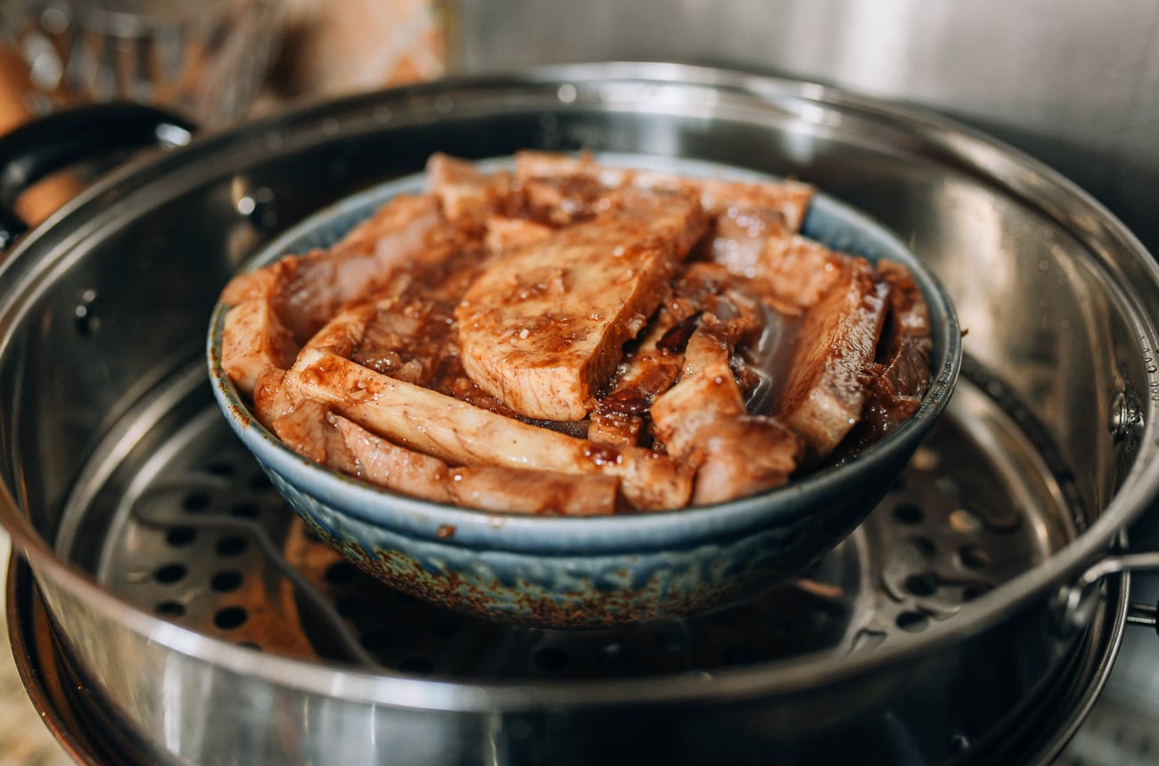 Bowl of taro and pork belly in steamer