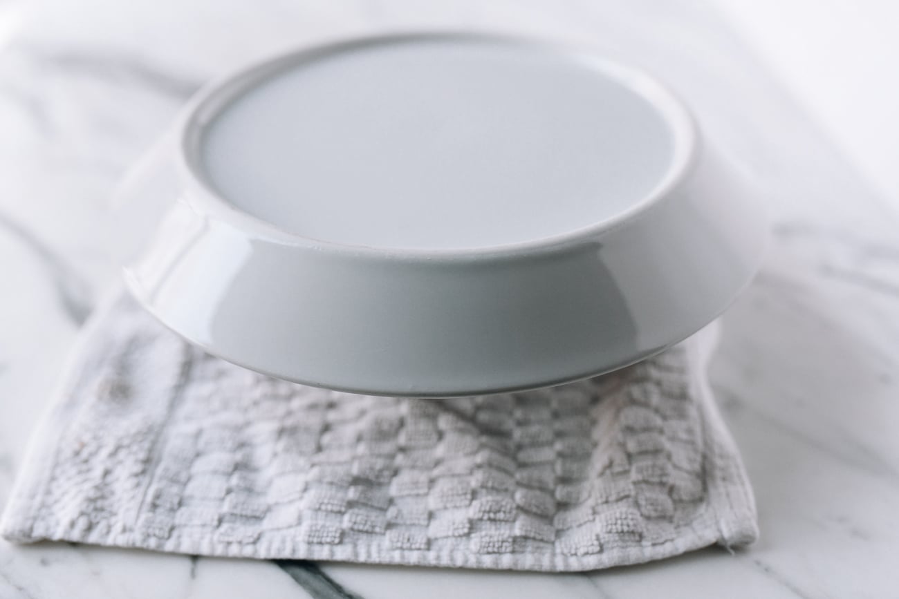 Placing serving plate on top of bowl