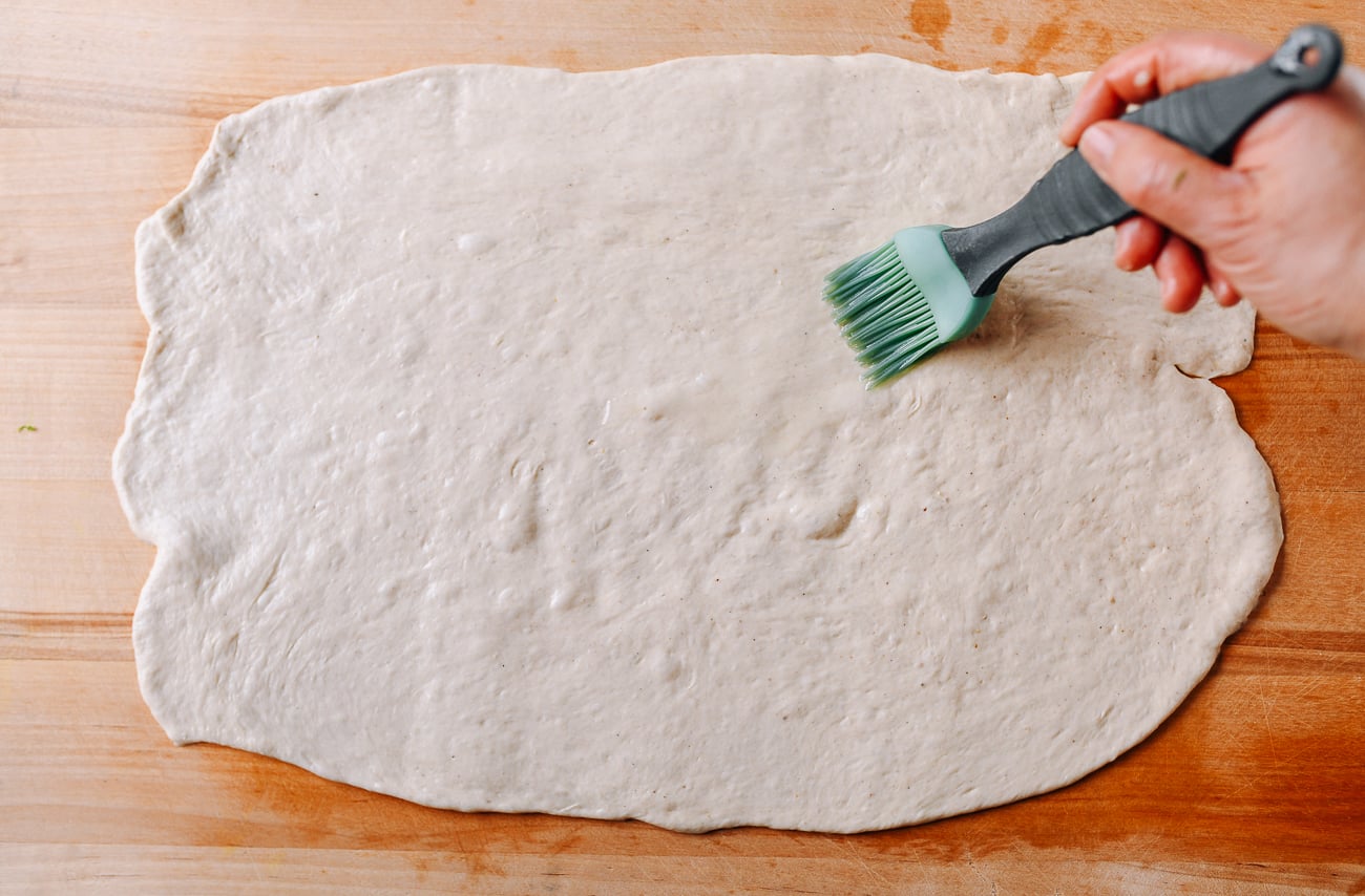 Brushing dough with oil