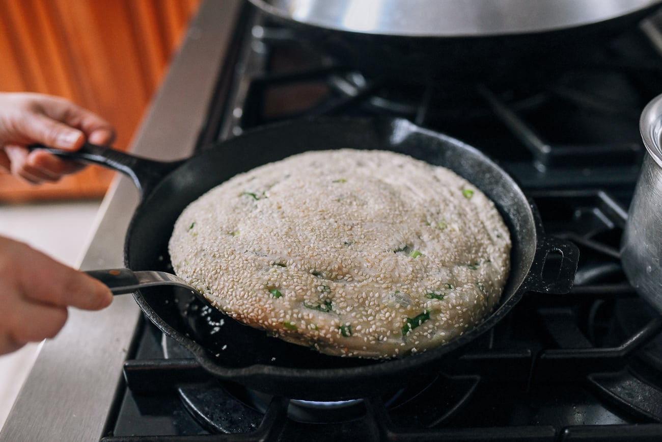 Checking on the bottom of the pancake with a spatula