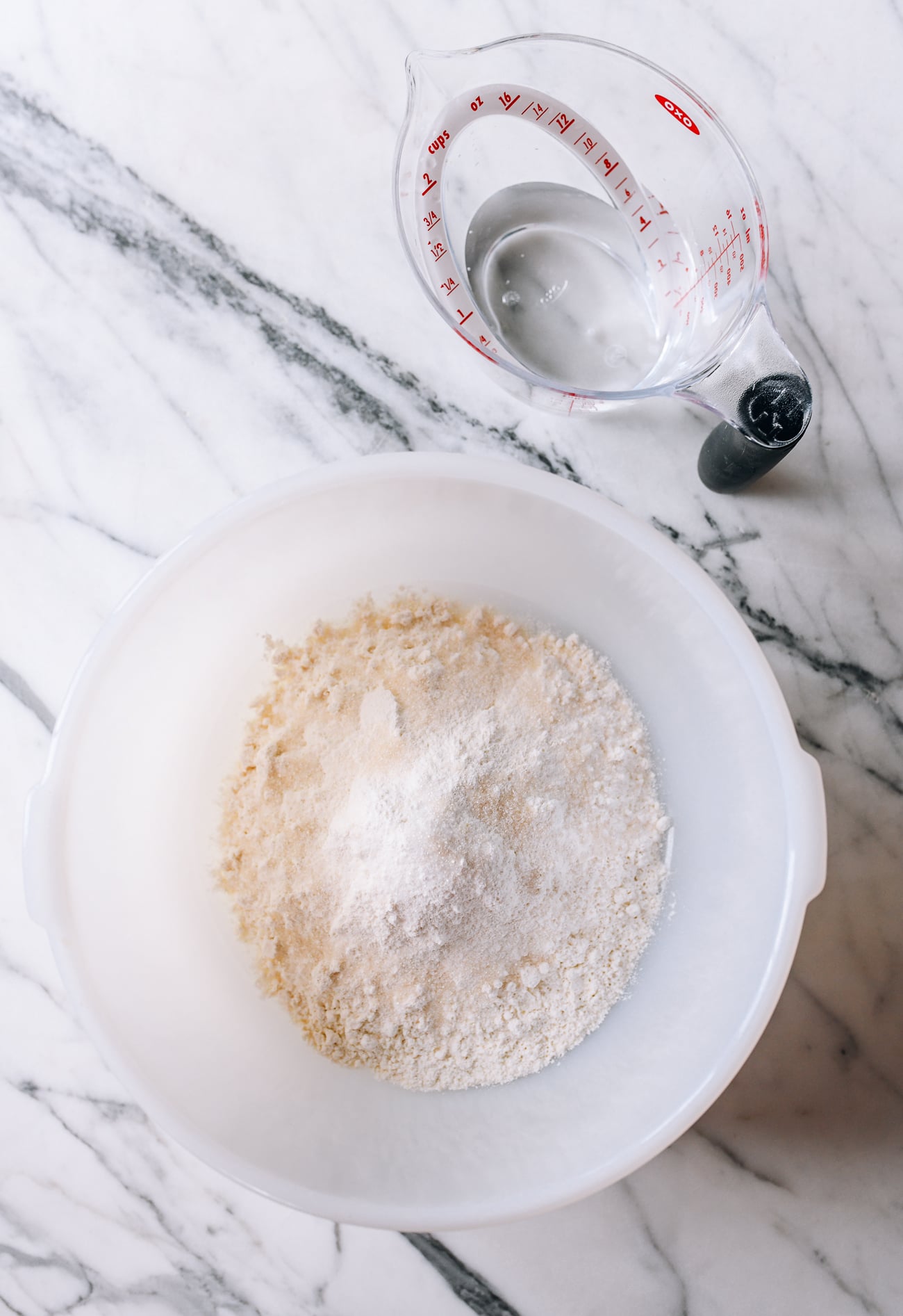 Flour, yeast, and sugar in bowl