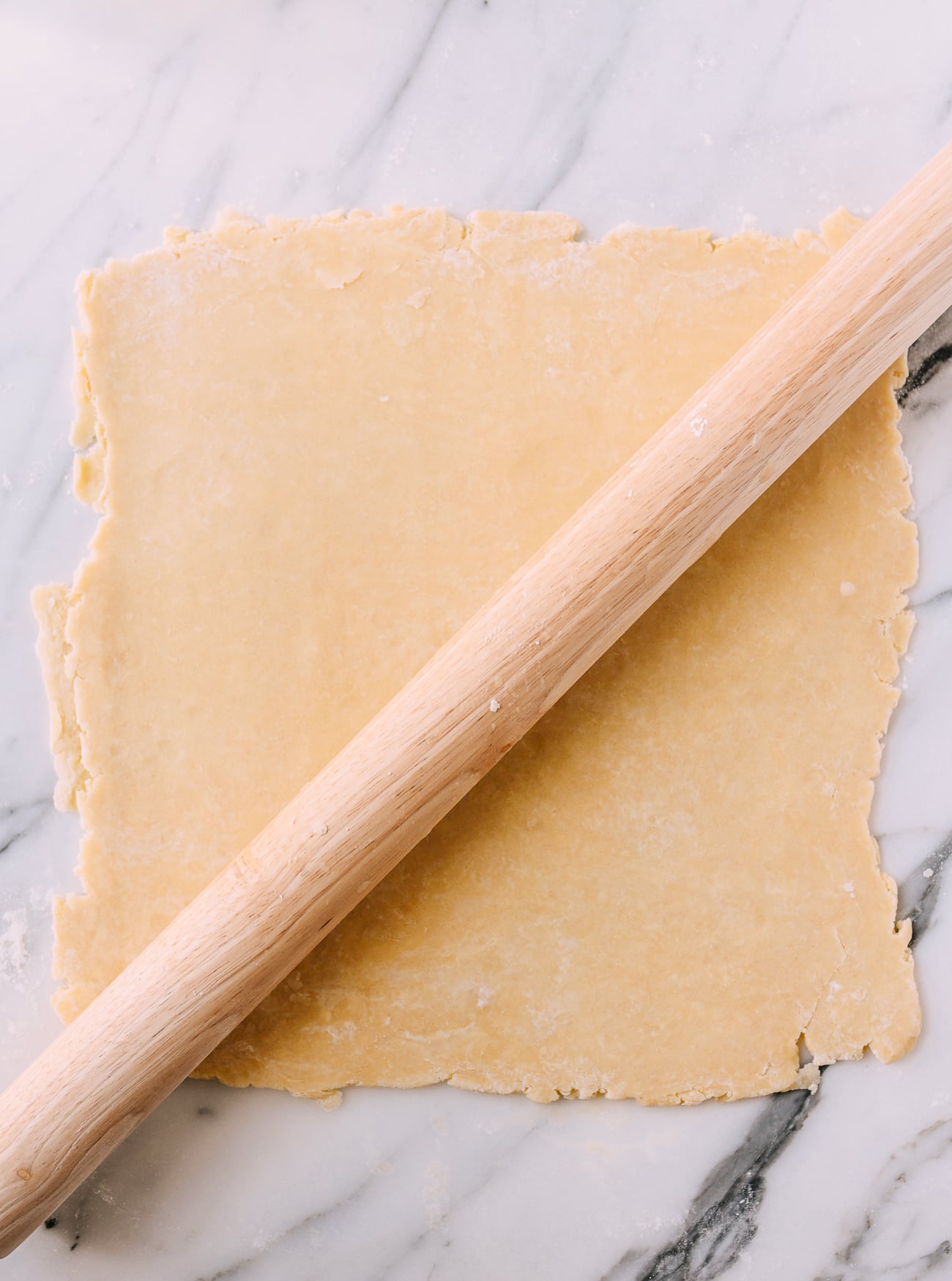 Rolling dough into large rectangle