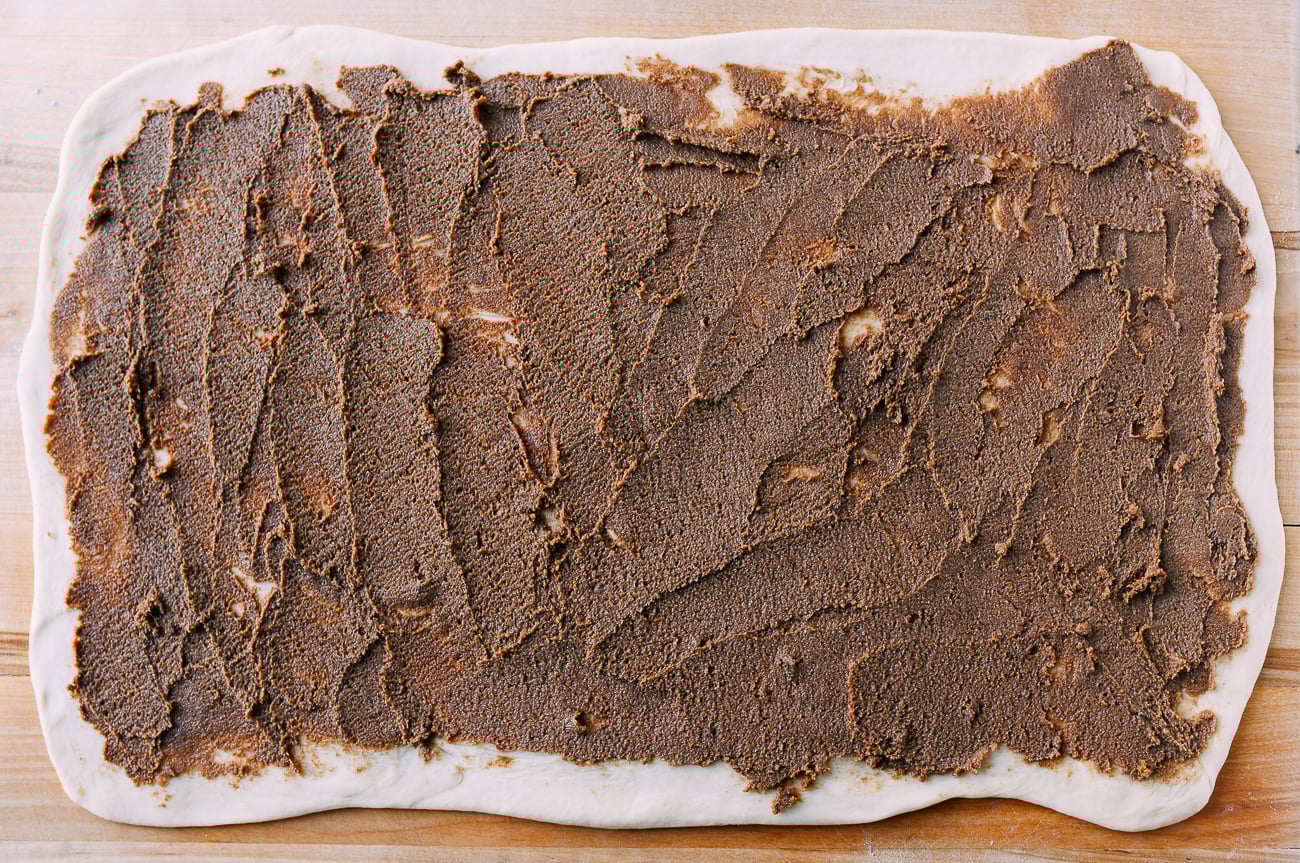 Cinnamon filling spread onto dough