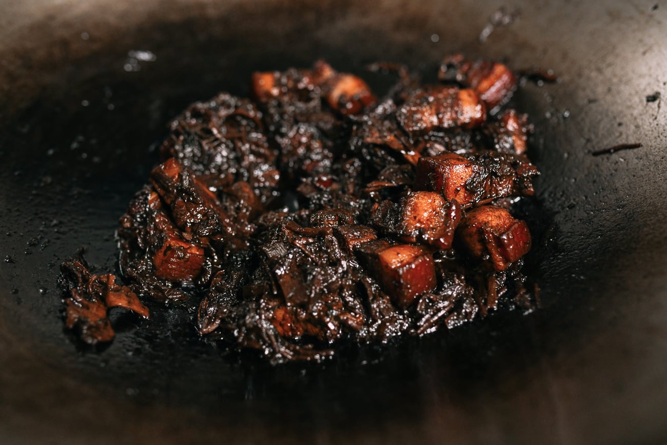 Reducing sauce down in Meigan Cai pork belly dish