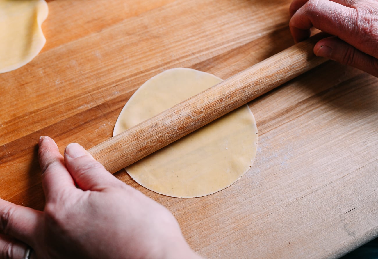Rolling dumpling wrapper into 4 inch circle