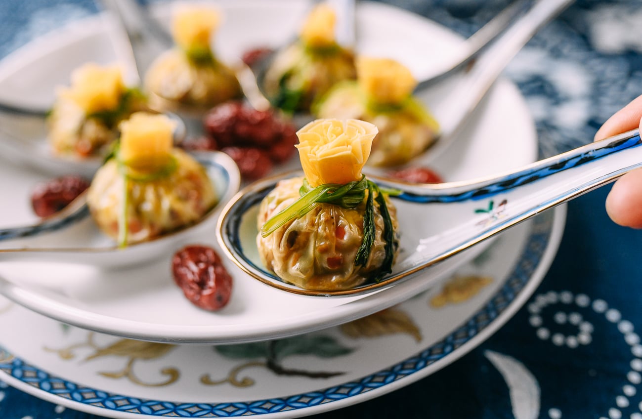 Steamed money bag dumpling in spoon