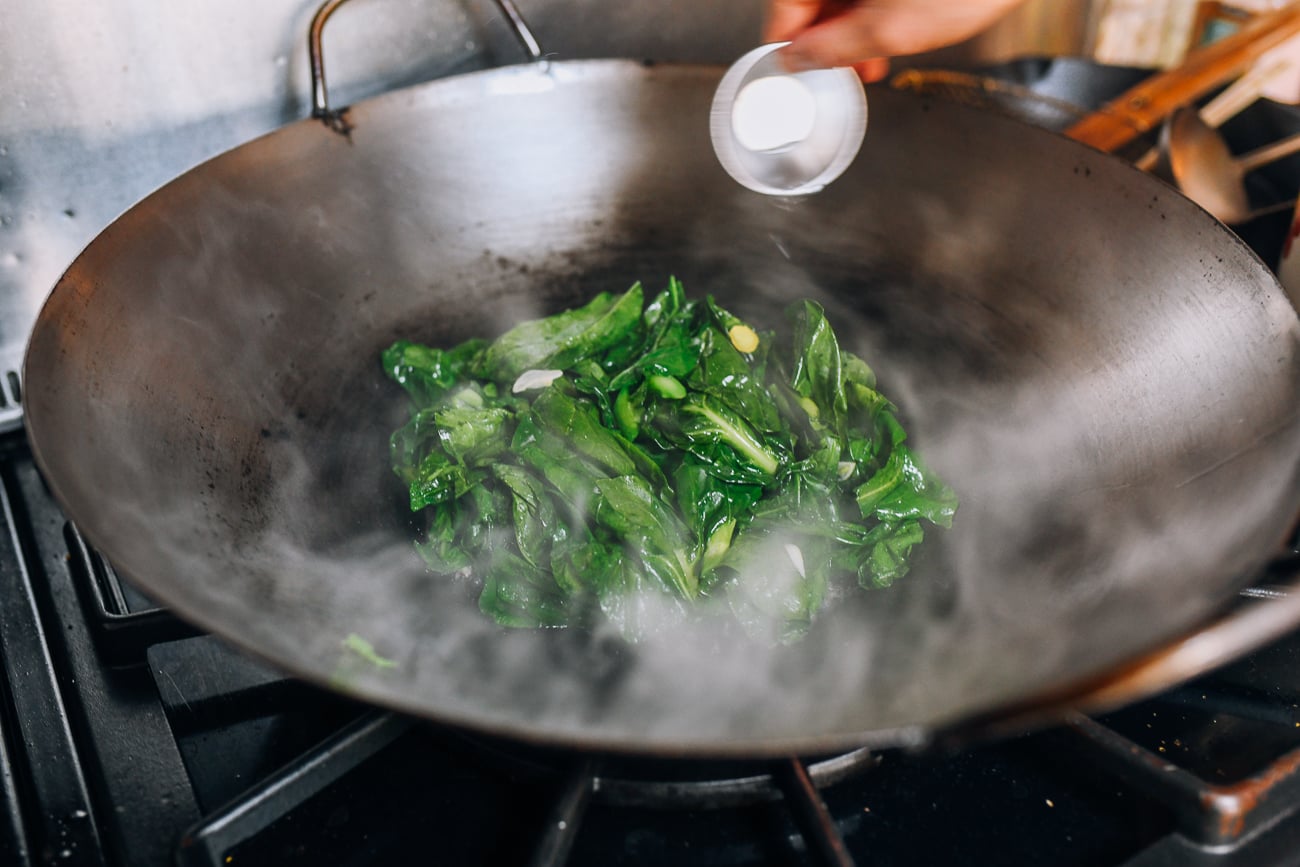 Pouring rice wine into vegetables