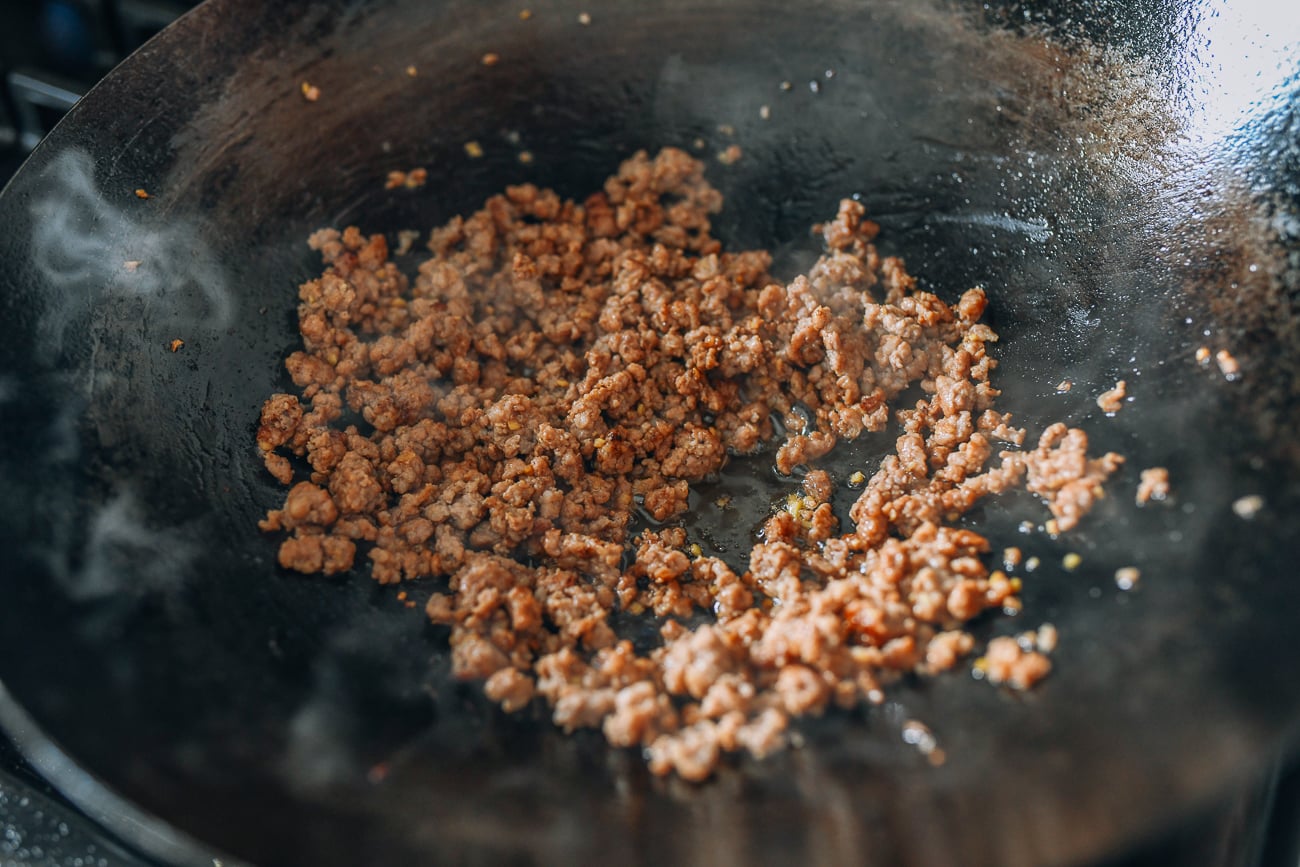Browning ground pork in wok