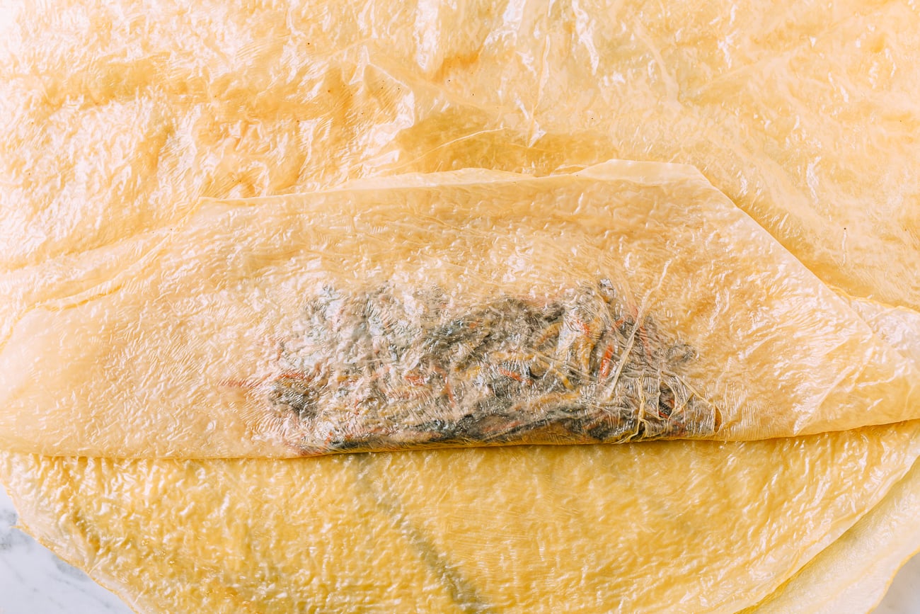 Wrapping bean curd sheets around filling