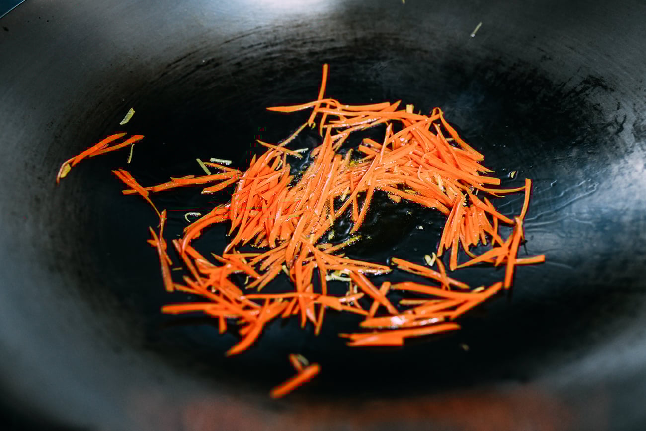 Stir-frying julienned carrots
