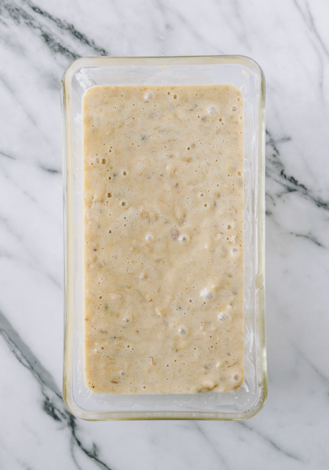 Banana bread batter in loaf pan