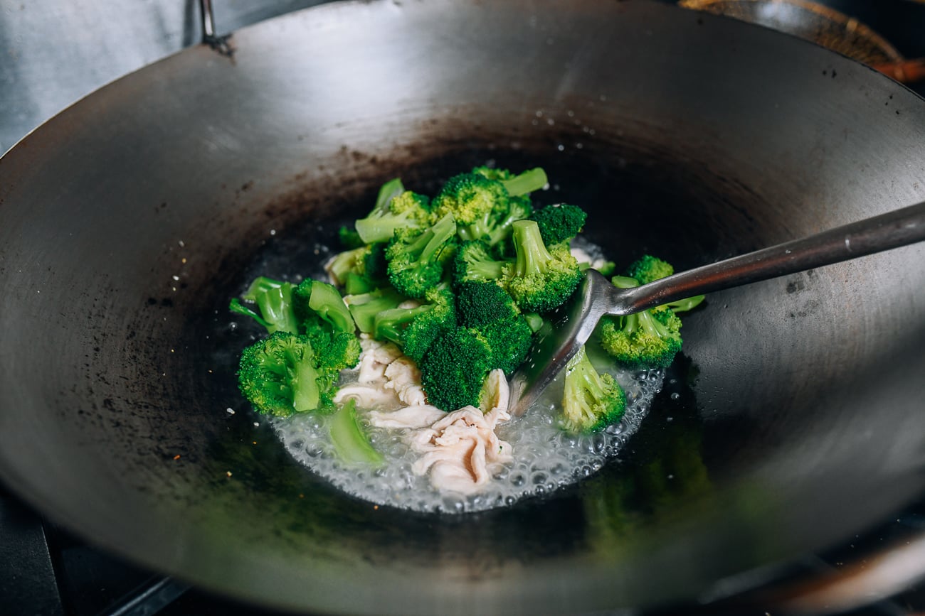 Adding broccoli to wok