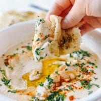 Dipping Laffa Bread into Hummus