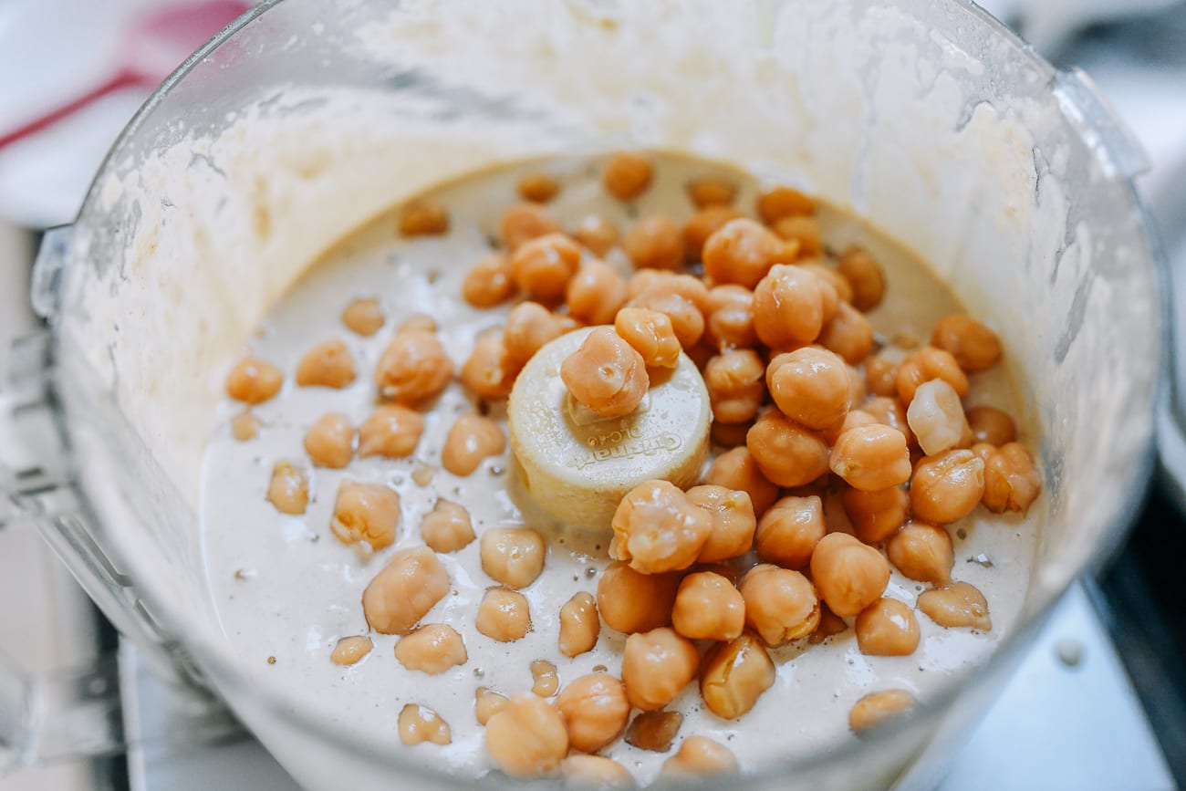 Adding chickpeas to tahini in food processor