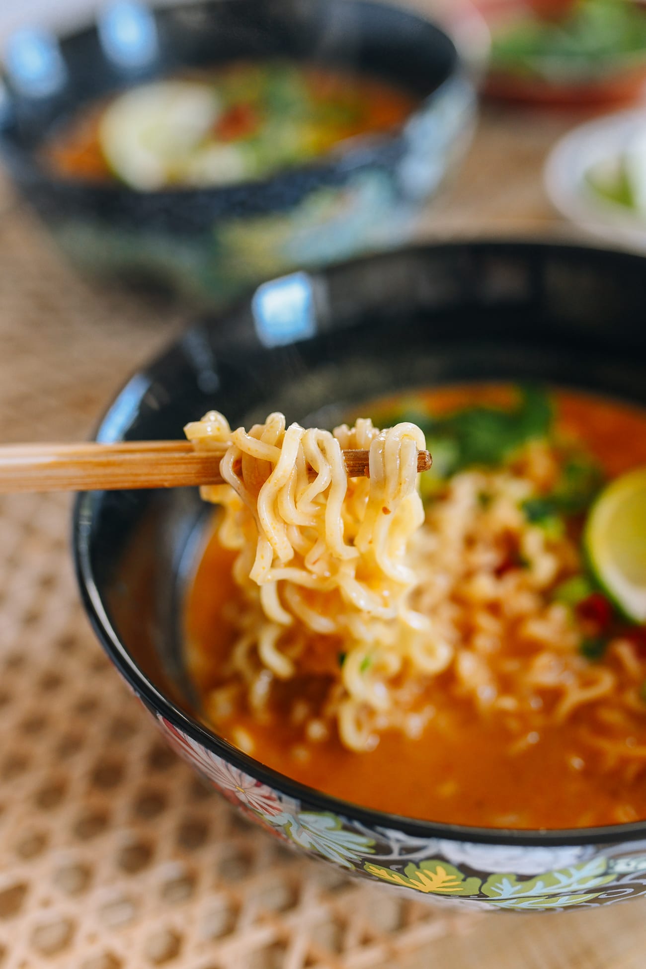 Picking up instant ramen noodles with chopsticks