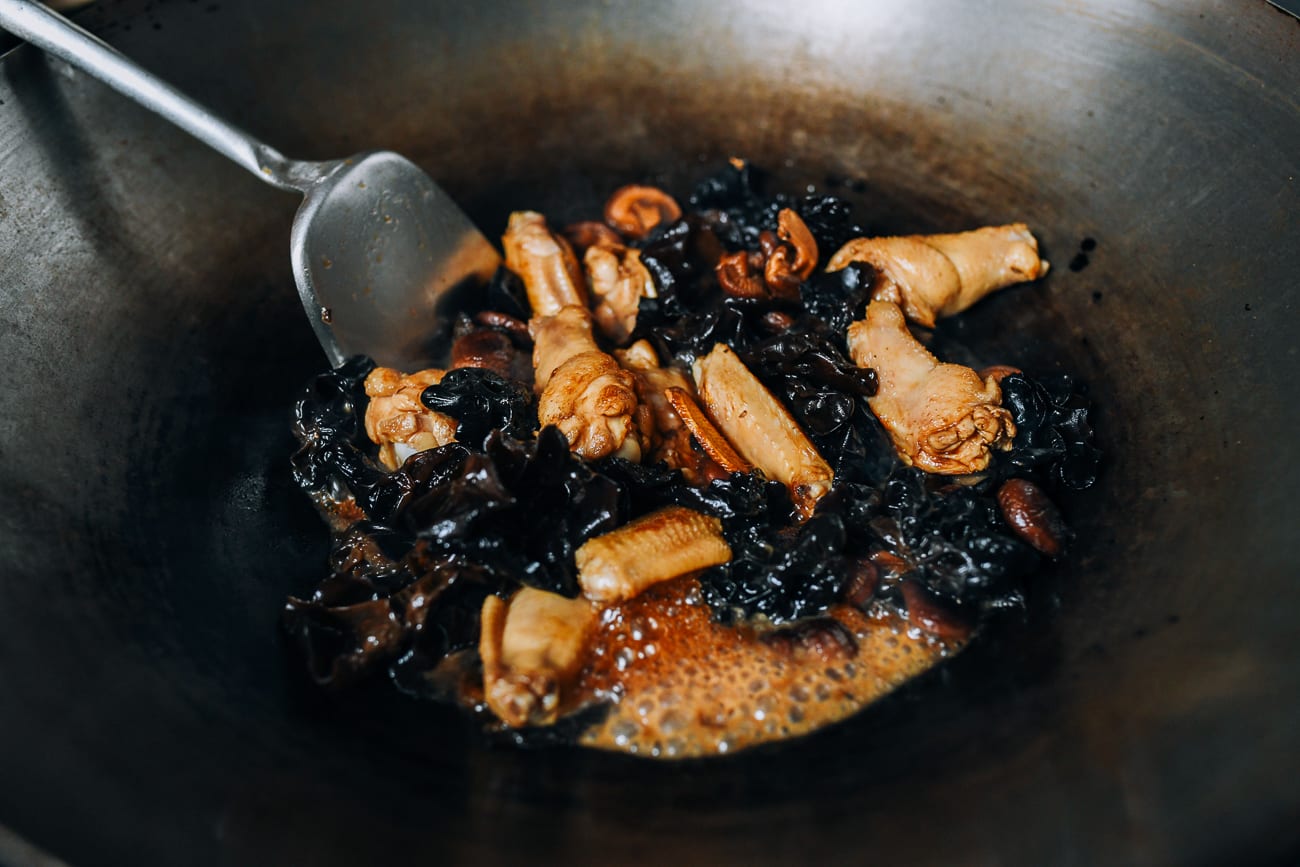 Stirring seasonings into chicken and mushrooms
