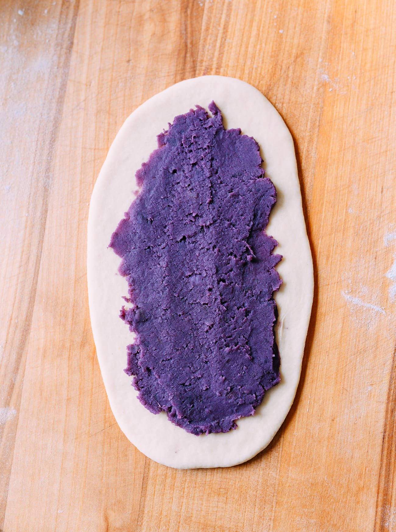 Ube filling spread onto dough
