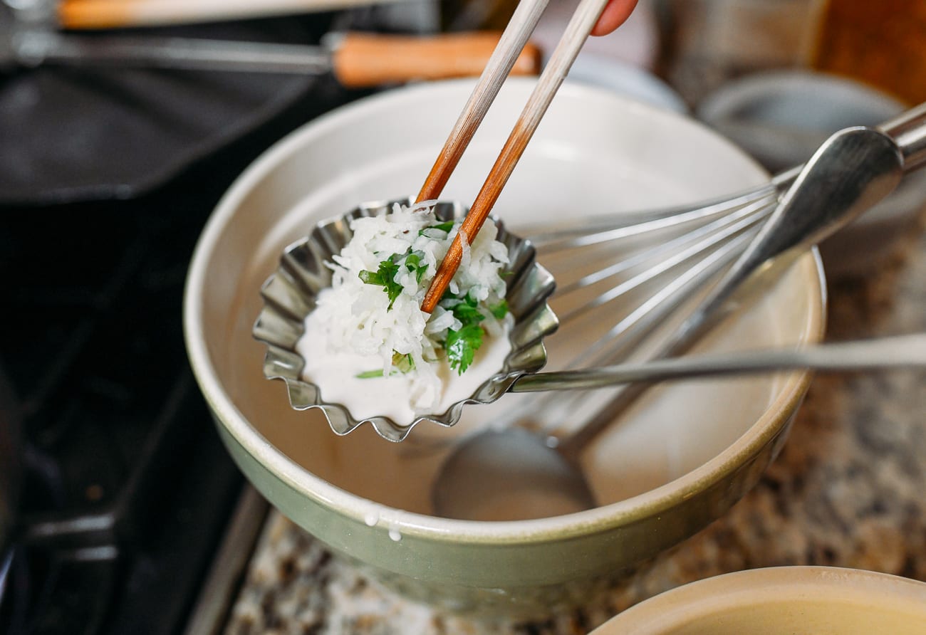 Adding shredded daikon radish on top of batter