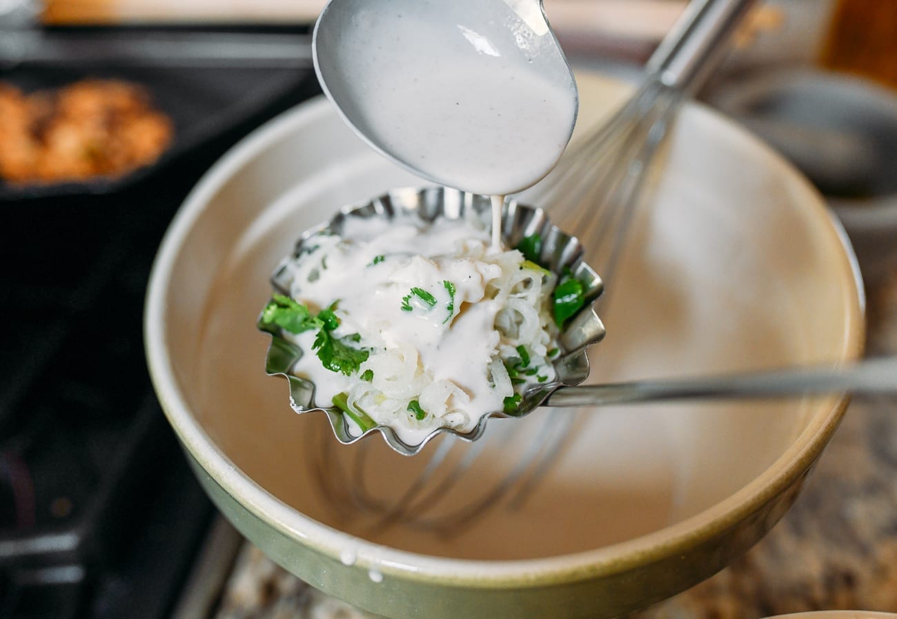 Drizzling batter on top of daikon mixture