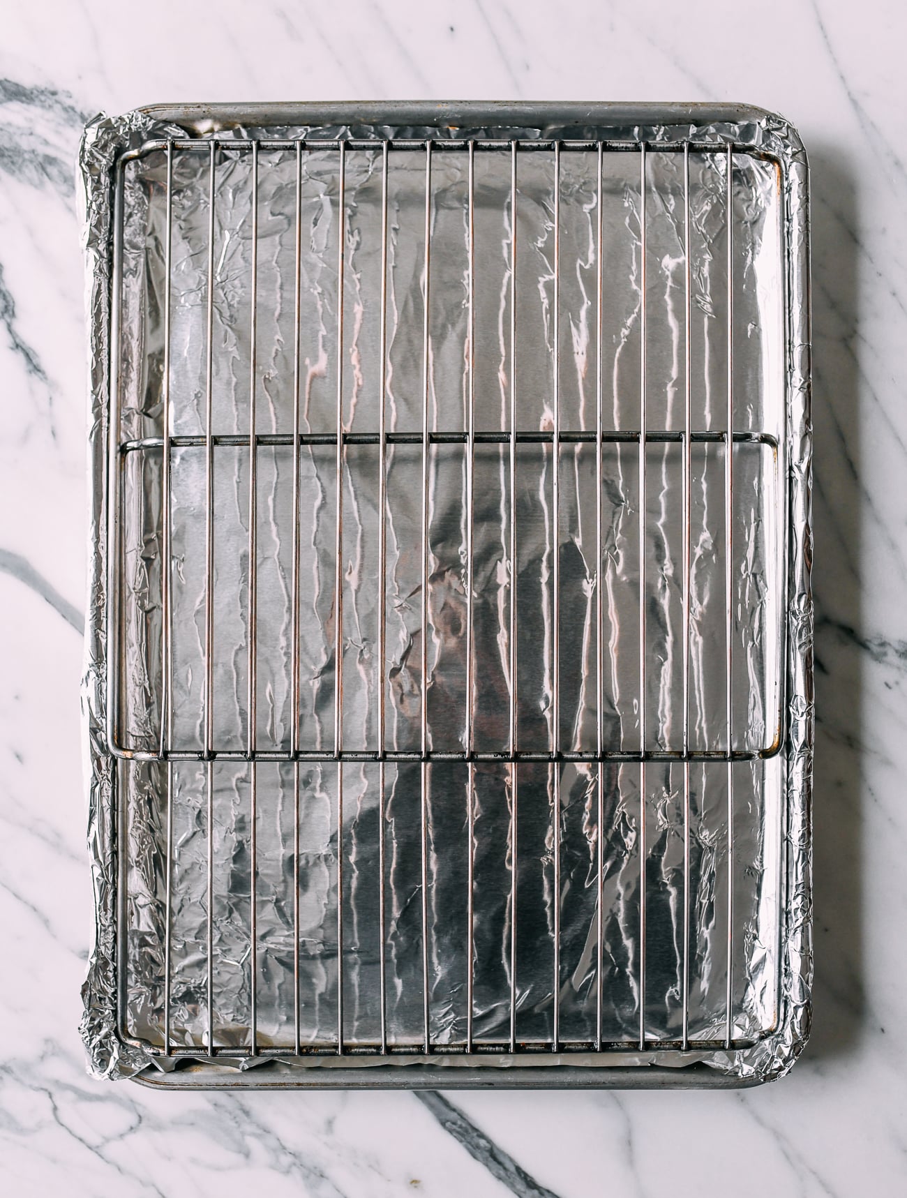 Foil-lined sheet pan with metal rack on top