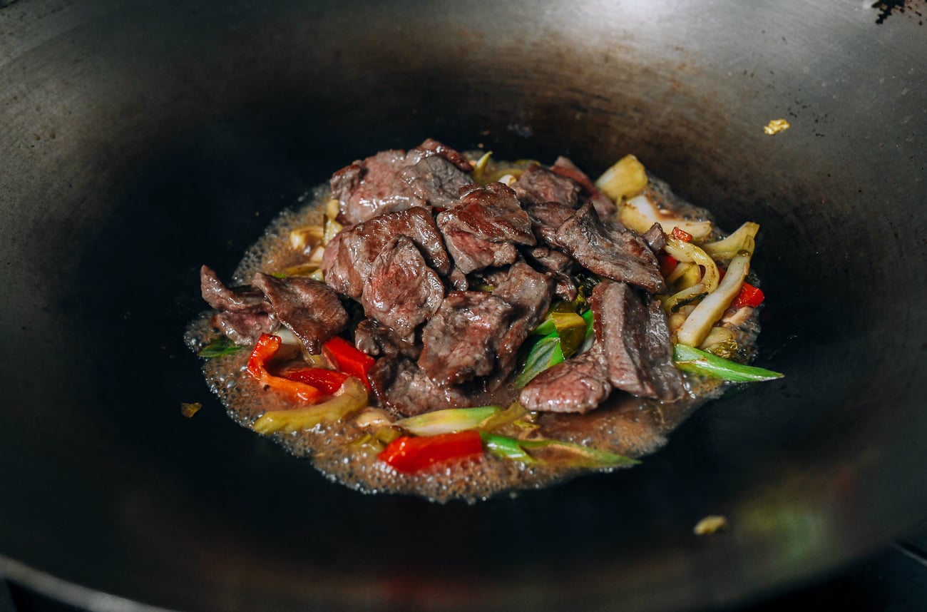 Adding beef back to wok