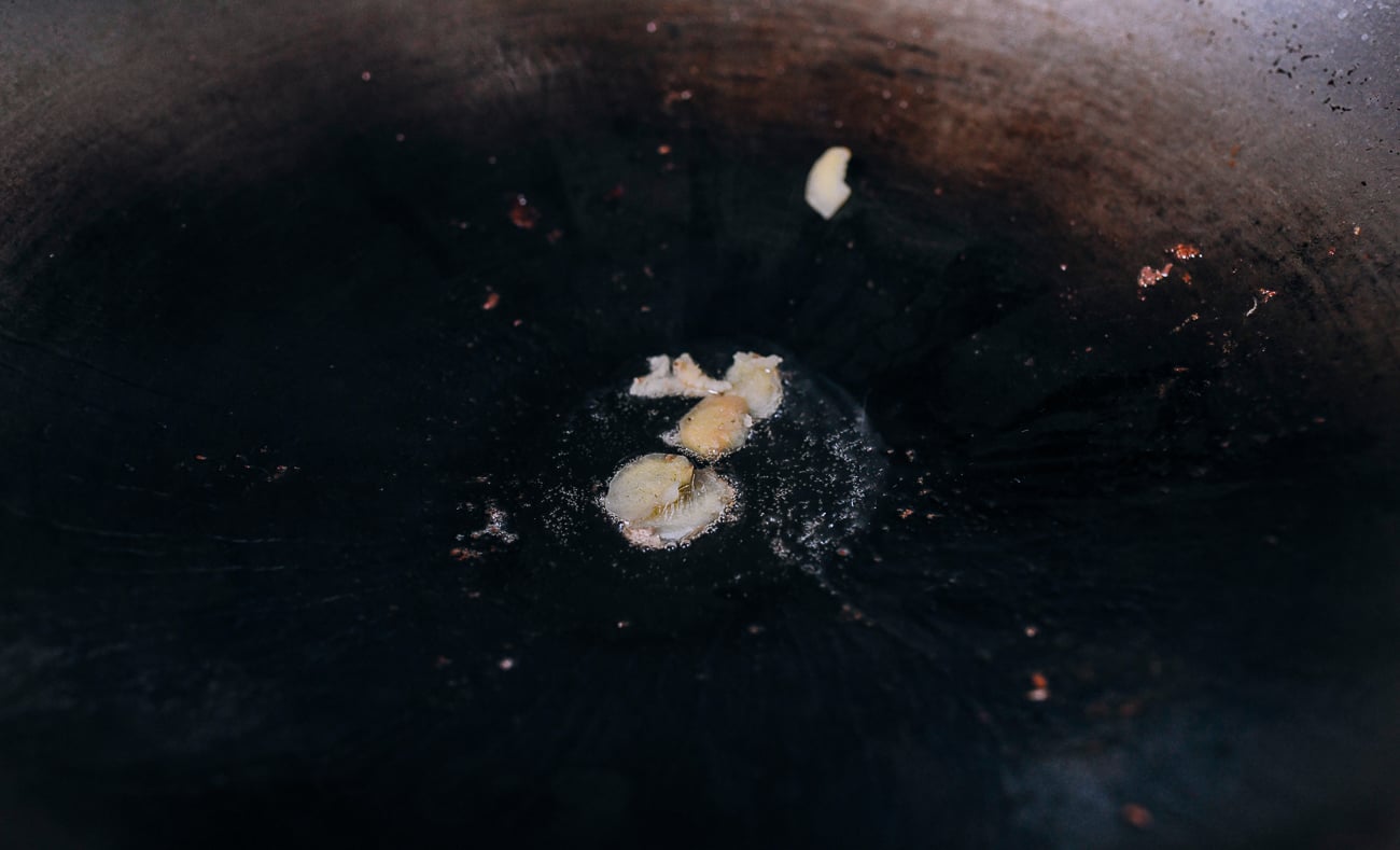 Smashed ginger pieces in oil