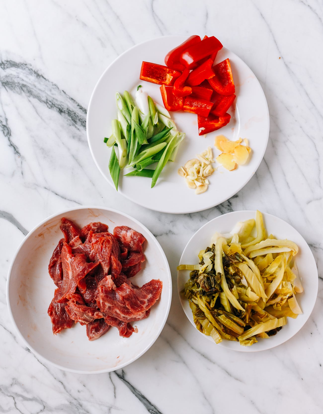 Marinated flank steak, scallions, peppers, garlic, ginger, and haam choy