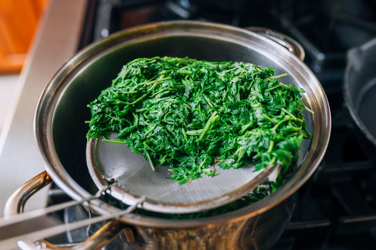 Removing blanched leaves from pot