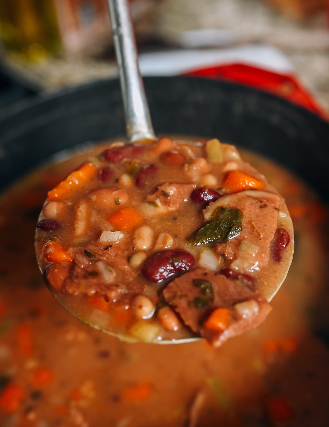 Ladle full of ham and bean soup