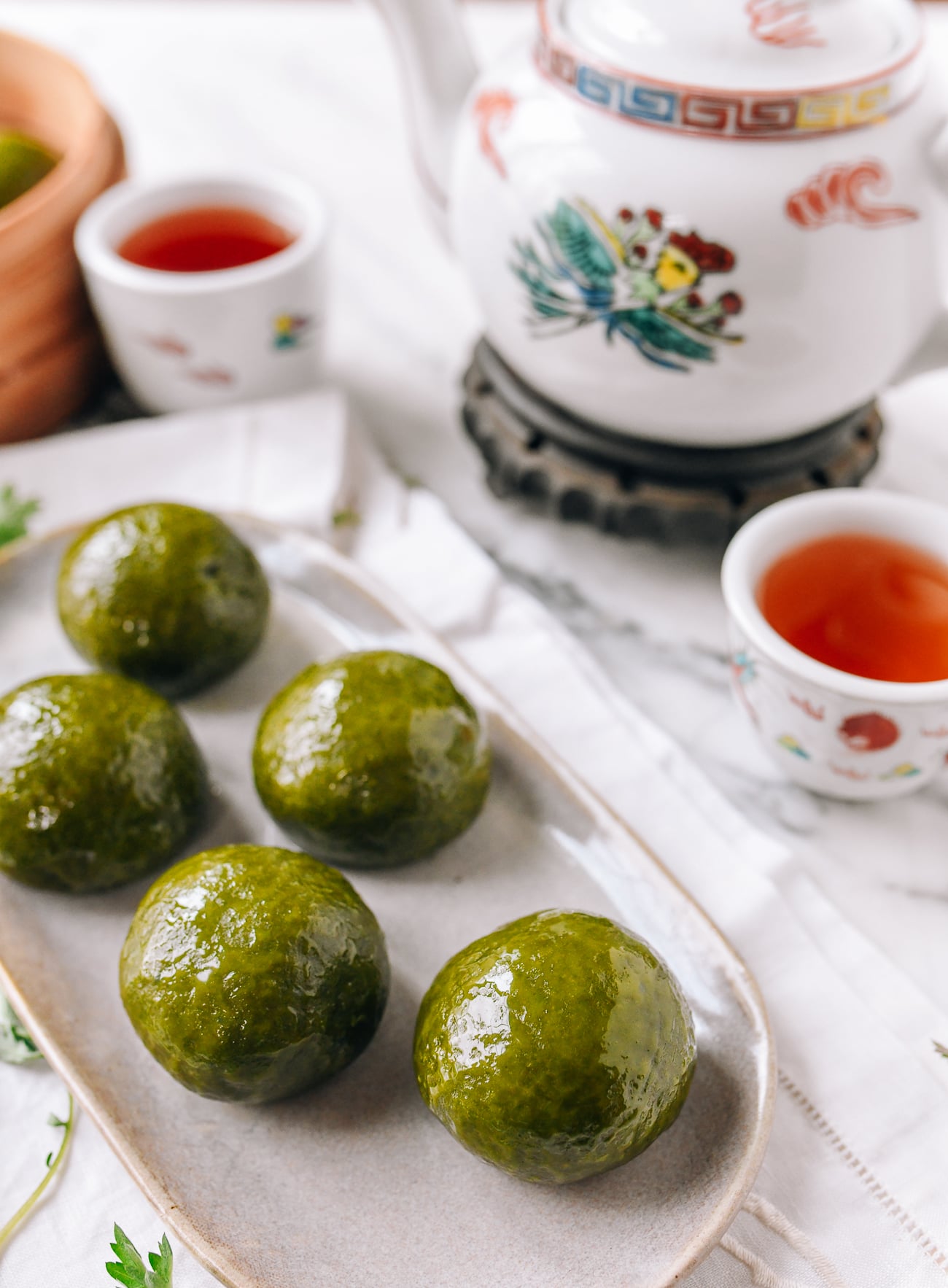 Qingtuan on plate with tea