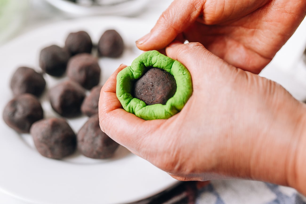 Sealing dough around red bean paste