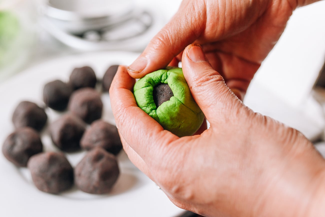 Sealing dough around red bean paste