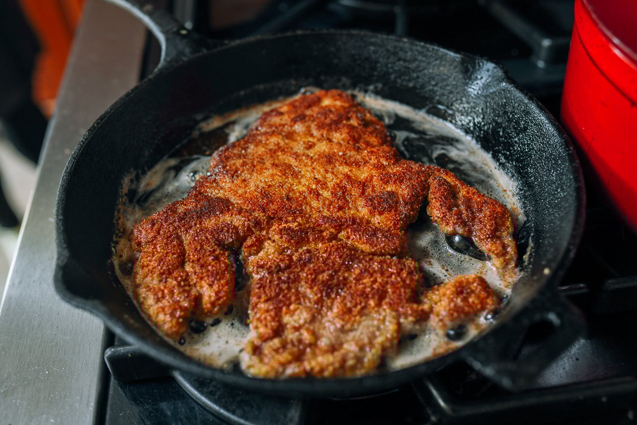 Pork Schnitzel frying in pan