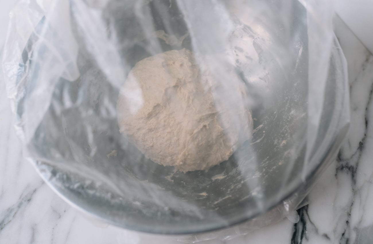 Dough covered with plastic bag