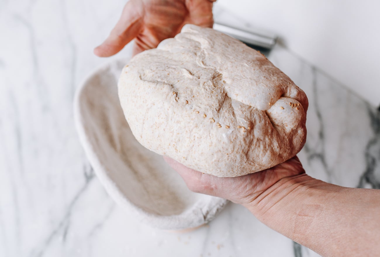 Placing bread into banneton